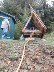 Meanwhile wiring is starting to be run from the solar panels, which will not be moved, through the orange flex pipe to the Conex box. The pipe will get covered with rocks and dirt to make it less noticeable and to keep people and elk from tripping on it.