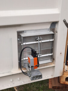upper and lower vents installed in the door next to the generator will open automatically when it starts up and close automatically when it is done.